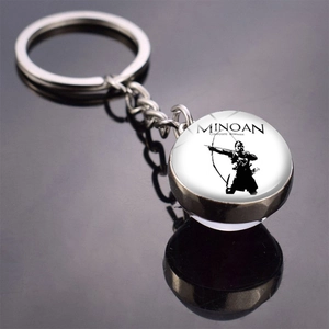 Macro detail of silver Roman glass ball keychain with Minoan composite bowman silhouette