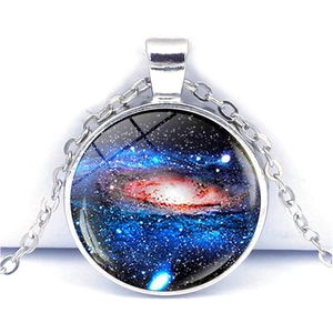Macro view of the silver galaxy pendant necklace with blue nebula glass dome and fine chain