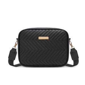 Black V-quilted camera bag with wide strap and gold hardware on white background