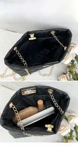 Detail of black quilted chain bag interior showing capacity for phone and cosmetics