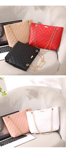 Close-up of quilted tote bag details with gold chain strap in multiple colors