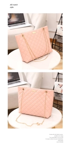Detail of pink quilted tote bag with golden metal plate and chain strap on a desk