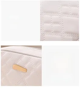Detailed view of white quilted leather texture and gold geometric metal ornament on bag