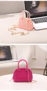 Detail view of mini shell purses with bead texture in orange and rose colors