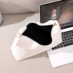 White quilted faux leather hobo shoulder bag with spacious black lining and gold hardware