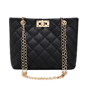 Classic black quilted shoulder bag with gold chain strap and metal turn-lock closure