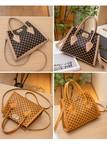 Detail of printed tote bags with gold twist-lock closure and detachable shoulder straps