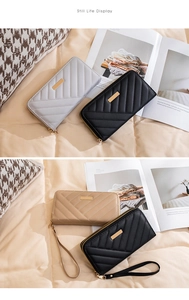 Detailed view of quilted long wallets with wristlet straps in black and khaki tones