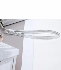 Detail of silver long wallet wristlet showing durable metal clasp and fine stitching