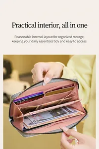 Detailed view of women's long grey wallet with pink lining, multi-card slots and zipper