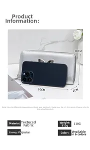 Detailed view of silver clutch wallet with rabbit ear charm and 20x10x2cm dimensions