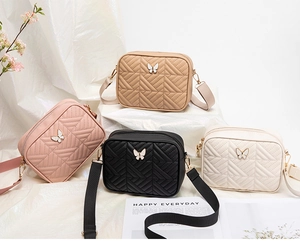 Detailed display of four quilted camera bags with wide straps and butterfly buckles