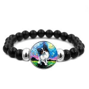 Zwarte kralenarmband in Van Gogh-stijl met een artistieke Papillon honden hanger