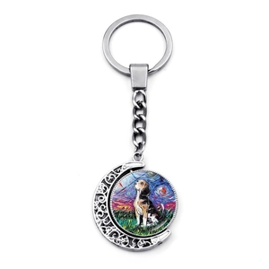 Detailed close-up of a silver spinning keychain with Van Gogh style beagle moon pendant