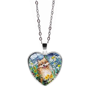 Macro detail of heart pendant showing Pomeranian oil painting and artistic starry background