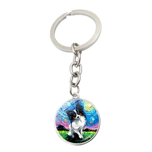 Détail d'un porte-clés rond avec chien Papillon de style Nuit étoilée de Van Gogh
