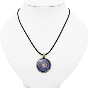 Bohemian bronze mandala flower pendant necklace with blue glass dome on white background
