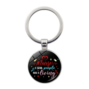 Macro detail of silver nurse keychain with creative professional text engraving