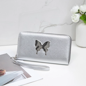 Silver long wallet for women featuring a metal butterfly and detachable wrist strap