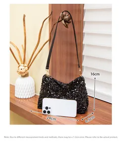 Detail view of black sequin shoulder bag with 24x16x8.5cm size dimensions listed