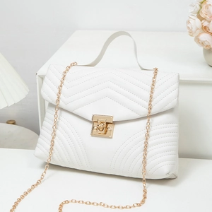 White quilted crossbody bag with V-shaped texture and golden chain strap for women