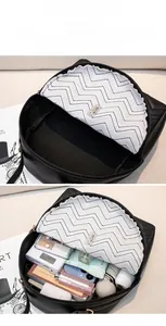 Internal view of quilted crossbody bag with dual compartments and daily essentials