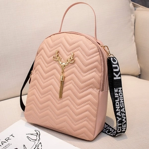 Pink quilted leather backpack for women with golden deer head and trendy wide strap