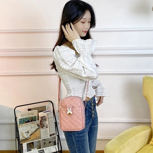 Pink quilted cross-body phone bag for women with cute white rabbit hardware and slim strap