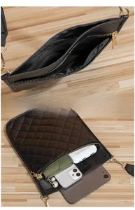 Internal view of quilted rhombus mini crossbody bag showing storage for phone and power bank