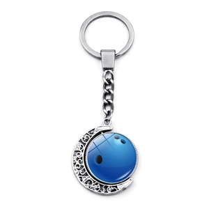 Detailed view of silver moon frame with dark blue bowling ball rotatable pendant