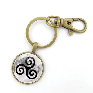 Vintage bronze keychain featuring a lunar triskelion glass pendant and lobster clasp