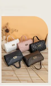 Detail of diverse colors and patterns on flap bags with gold chains on wood surface