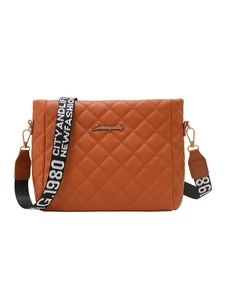 Brown quilted crossbody bag with wide nylon strap and gold logo in a minimalist design