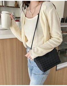 Chic women's crossbody bag with retro geometric pattern shown in a lifestyle setting