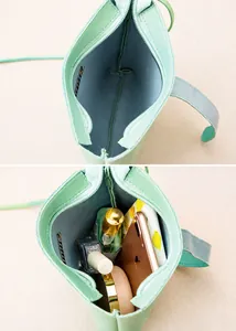 Détail de l'intérieur du sac seau vert menthe montrant le rangement pour téléphone