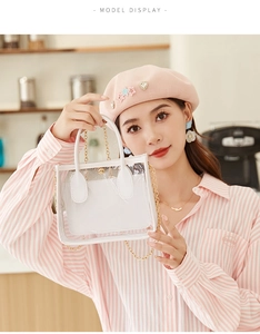 Borsa trasparente in PVC con pochette interna in pelle bianca e catena in metallo dorato