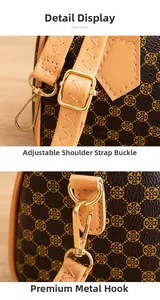 Detailed macro view of golden metal hardware and adjustable strap on a cylinder bag