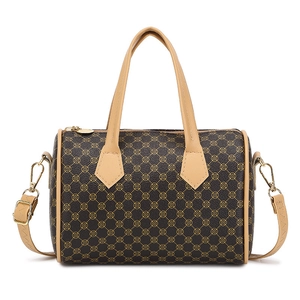 Classic cylinder boston bag with heart monogram pattern and adjustable shoulder strap