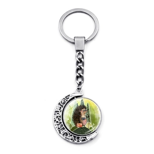 Hedgehog violin player keychain featuring rotating crescent moon frame and cute cartoon charm