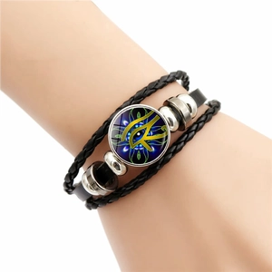 Men's braided leather bracelet featuring a blue Eye of Horus glass charm and metal beads