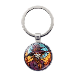 Halloween keychain with a round evil scarecrow glass pendant and silver keyring