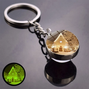 Luminous Christmas keychain with double-sided glass dome showing snowy winter scene