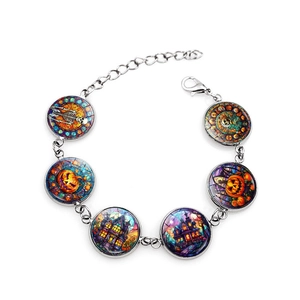 Halloween charm bracelet with ghost and pumpkin glass dome pendants on silver chain