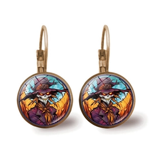 Detail of Halloween drop earrings featuring a scarecrow skull and orange background
