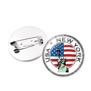 Detailed front and back view of a round New York Statue of Liberty souvenir badge