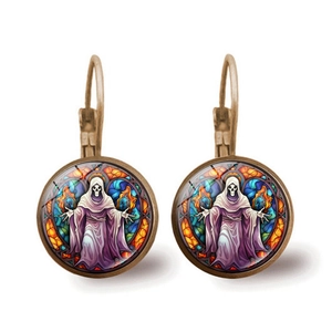 Macro shot of gothic bronze earrings featuring skull stained glass art and leverback hooks
