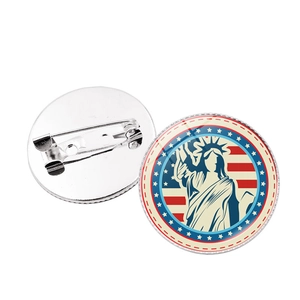 Front and back detail of vintage Statue of Liberty American flag badge with safety pin