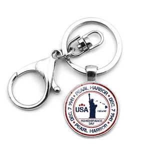 Detail of Pearl Harbor memorial keychain with Statue of Liberty and metal lobster clasp