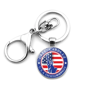 Detail of metal keychain with lobster clasp, US flag and Statue of Liberty design