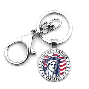 Silver metal keychain with Statue of Liberty and US flag design on a round pendant